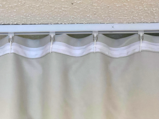 1 tape with plastic hooks for ceiling track system or rods with rings,  tape will be sewing into the top of curtain. Curtains not included